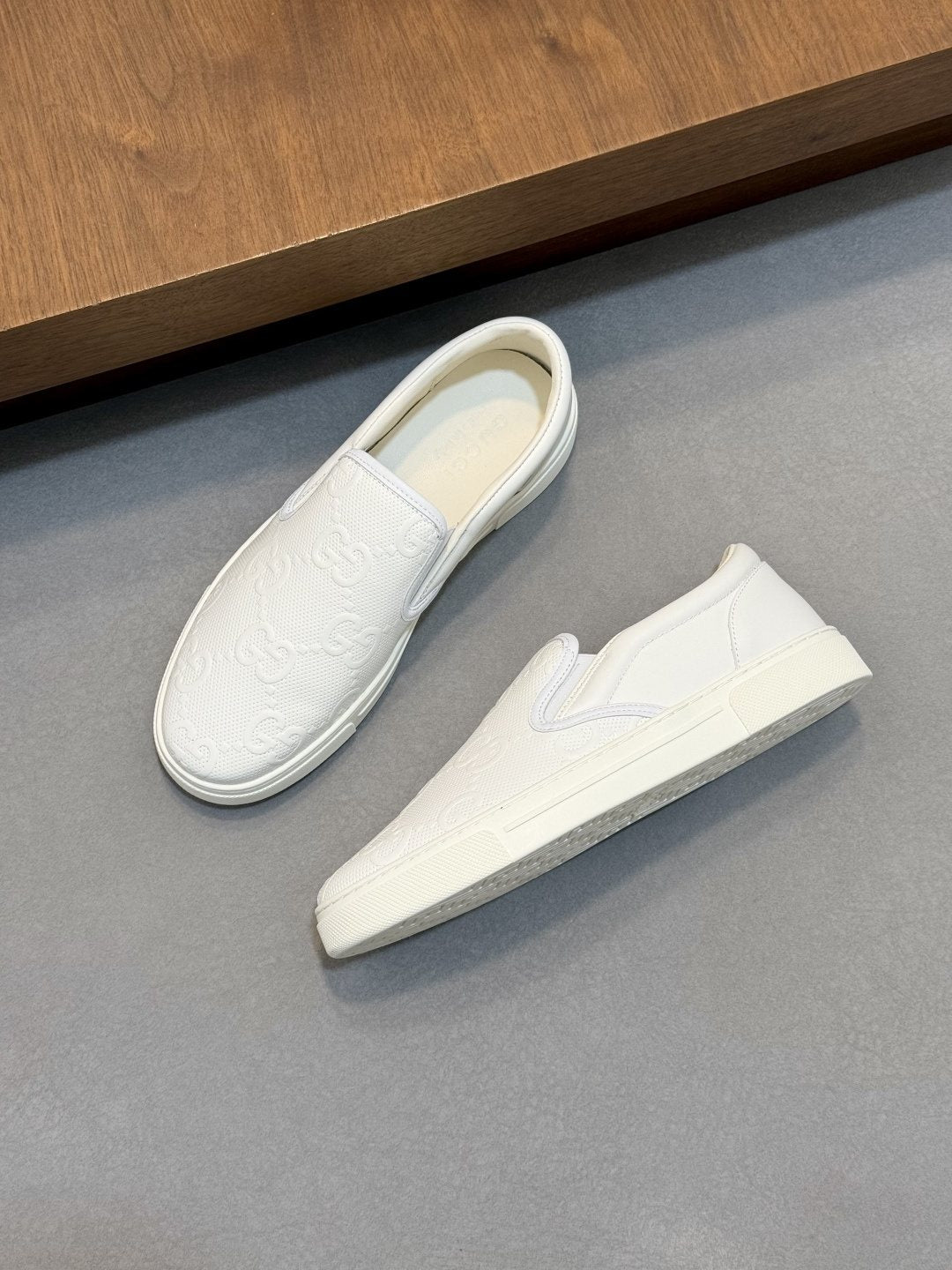 Gucci Embossed Slip-On Sneakers — front